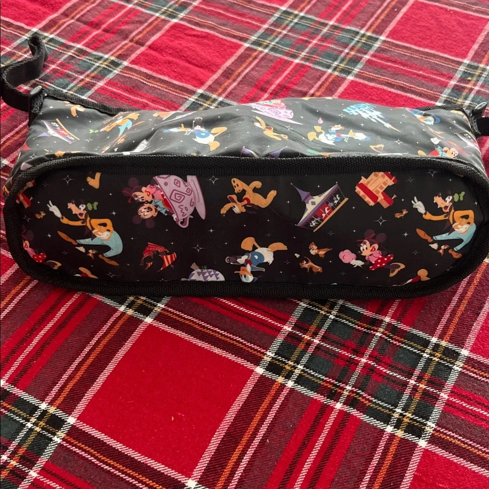 Disney Parks Stroller Organizer featuring an allover character print. GUC